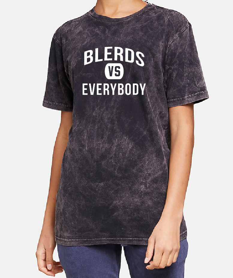 Person wearing a black acid-wash t-shirt with 'BLEARDS VS EVERYBODY' text on a plain background