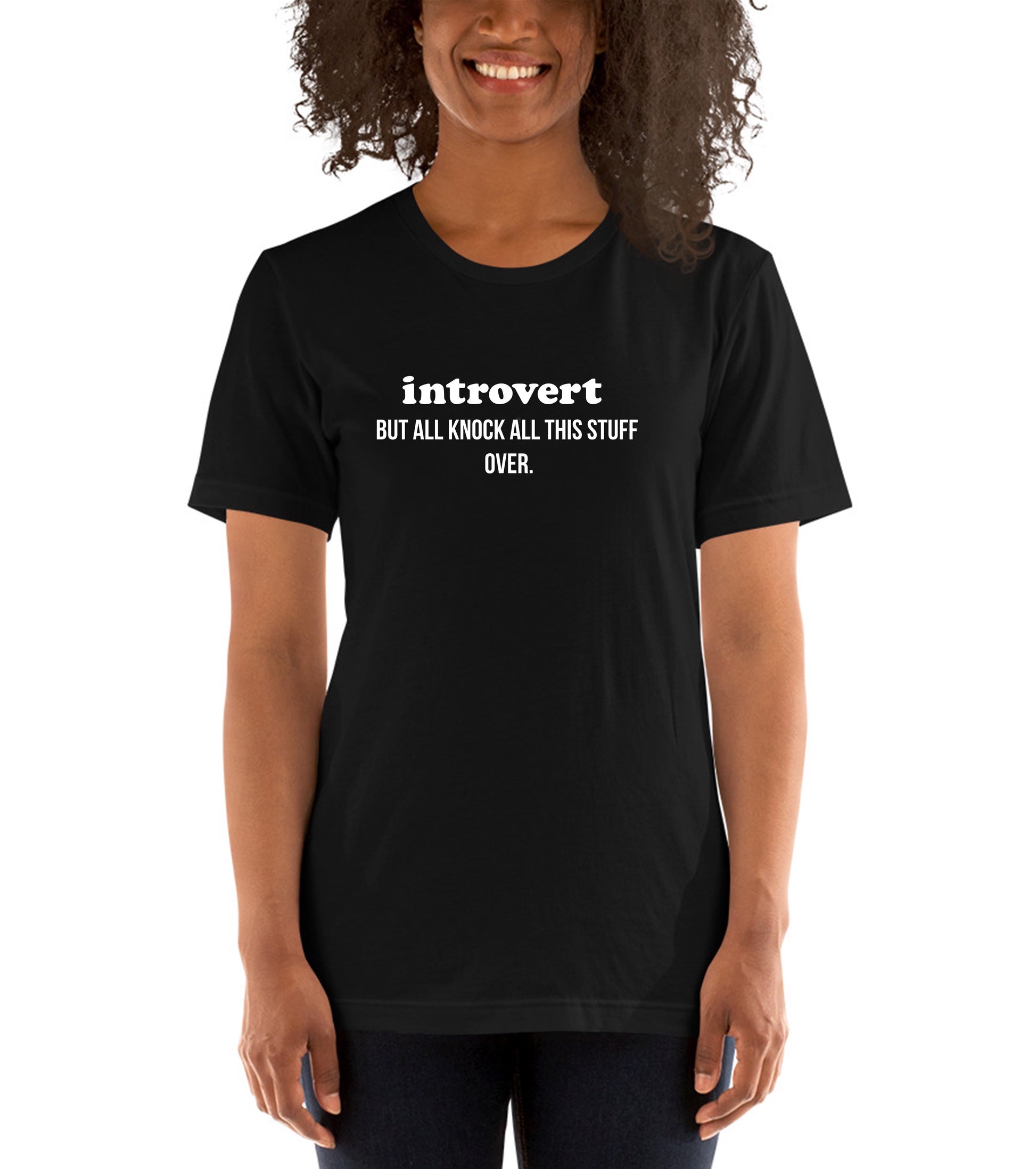 Person wearing a black t-shirt with 'introvert BUT ALL KNOCK ALL THIS STUFF OVER.' text.
