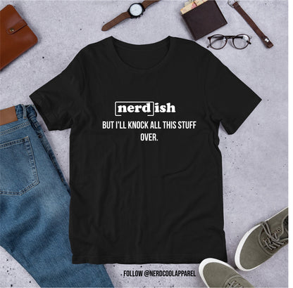 Black t-shirt with 'nerd-ish' text on a gray surface with jeans, shoes, and accessories.