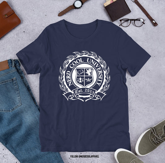 Navy blue t-shirt with 'New Cool University' logo on a gray surface with jeans, shoes, and accessories.