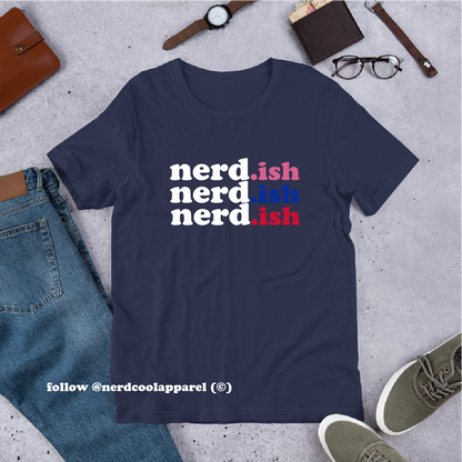 Navy blue t-shirt with 'nerd.ish' text on a gray surface with casual items around
