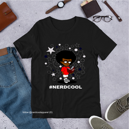 Black t-shirt with a graphic design and '#NERDCOOL' text, surrounded by casual items on a concrete surface.