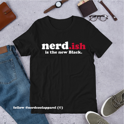 Black t-shirt with 'nerd.ish is the new Black' text on a concrete surface with casual items.