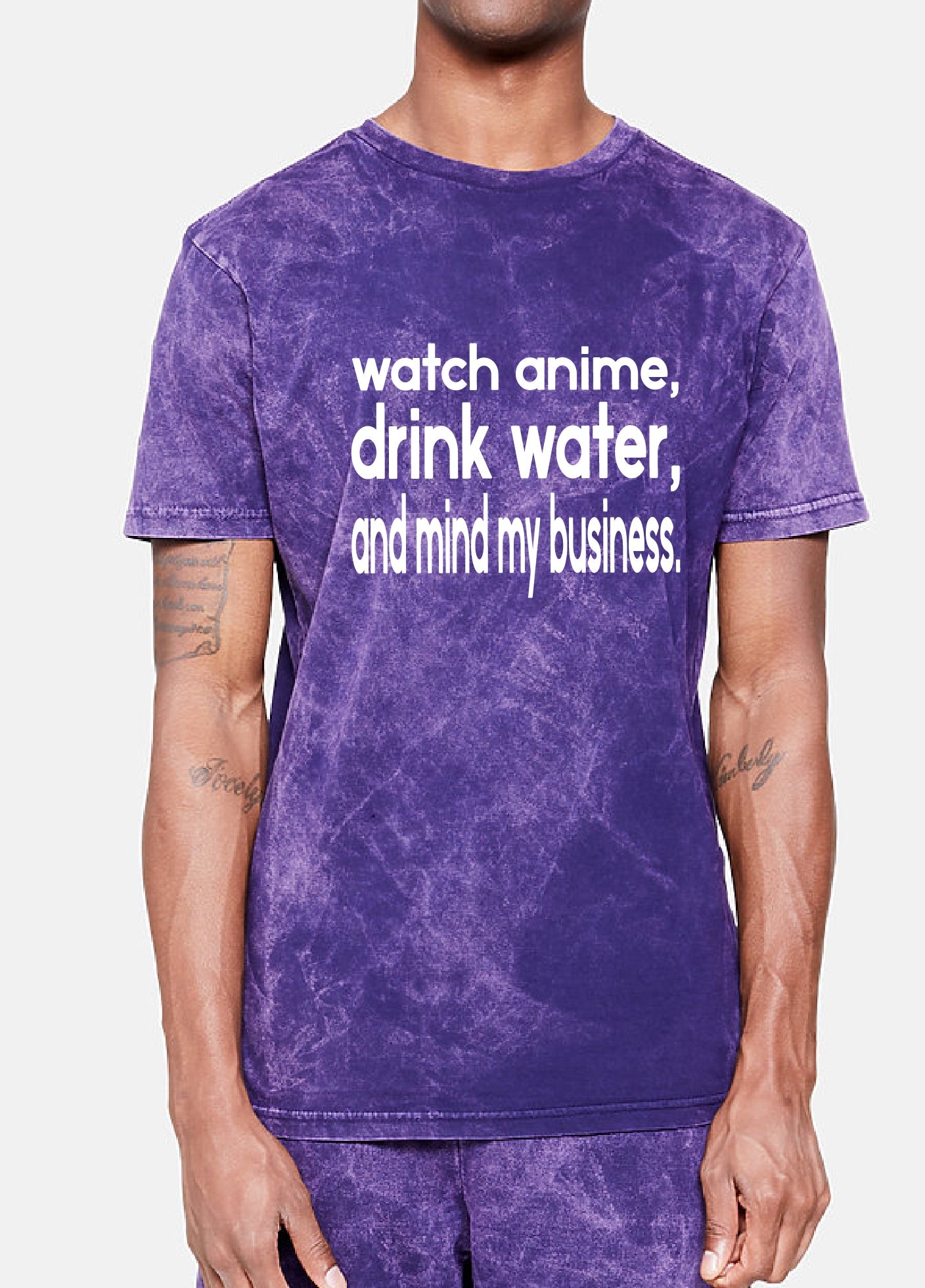 Person wearing a purple t-shirt with text on a white background