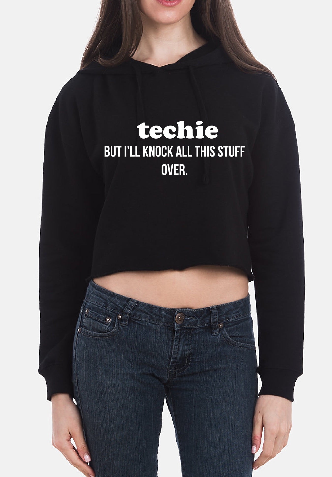 Person wearing a black hoodie with text and blue jeans on a white background