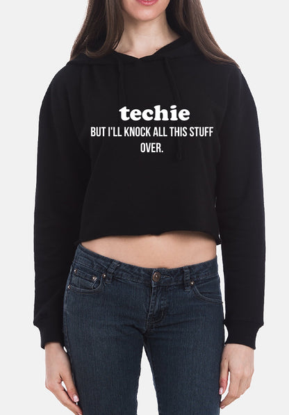 Person wearing a black hoodie with text and blue jeans on a white background