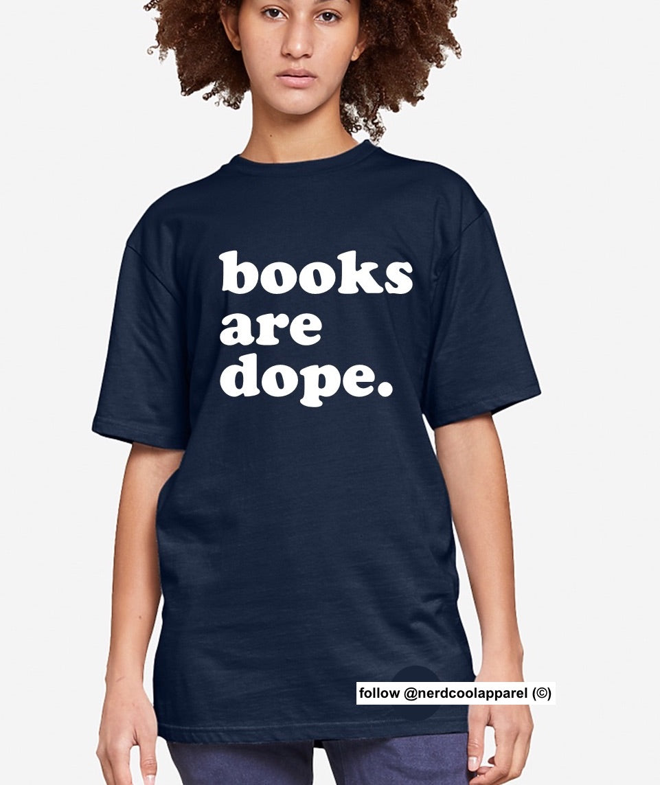Person wearing a navy blue t-shirt with 'books are dope.' text on a white background