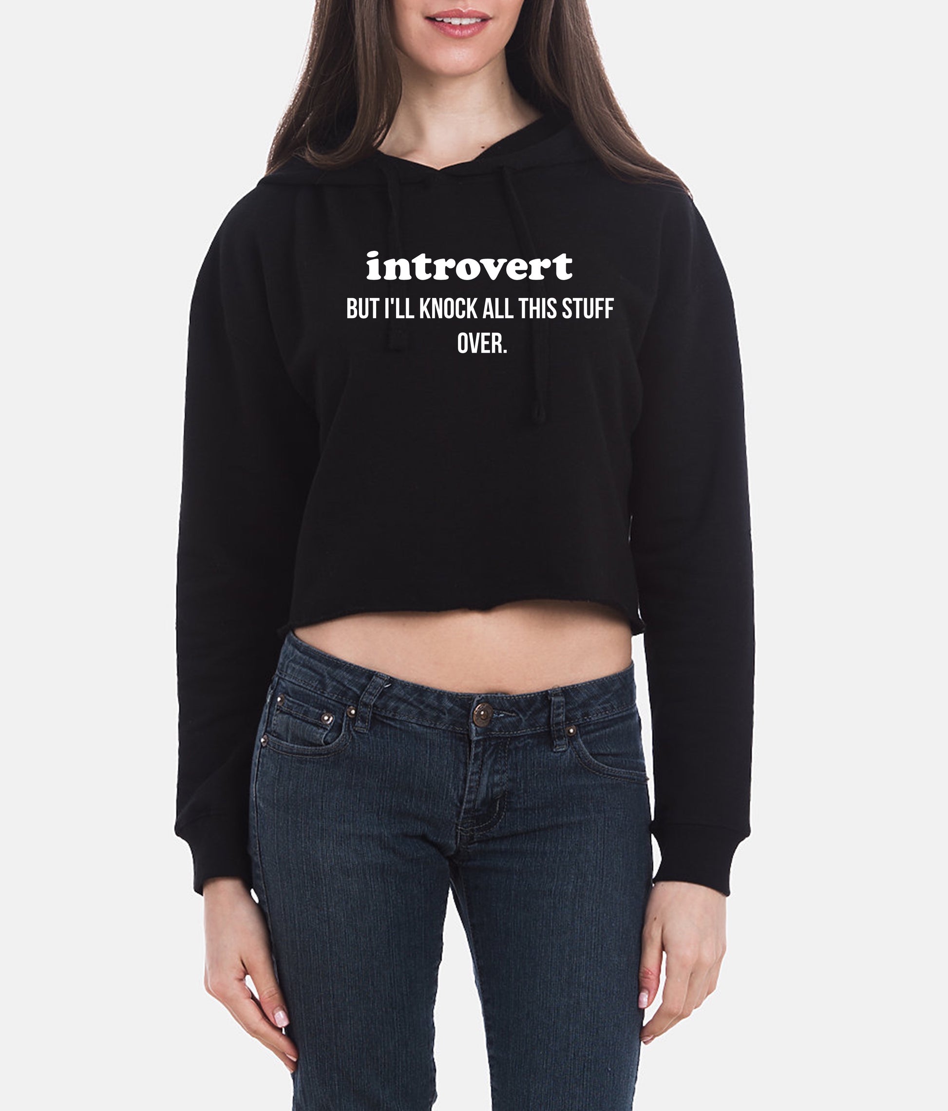 Person wearing a black hoodie with text and blue jeans on a white background