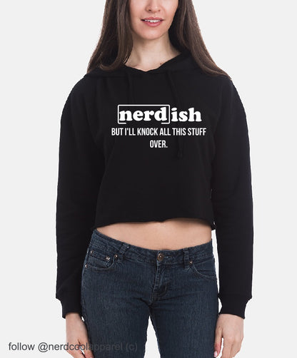 Person wearing a black hoodie with text and blue jeans on a white background